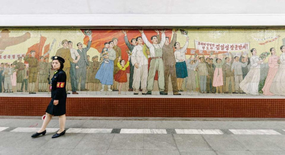  Murals on the city's walls display celebratory scenes