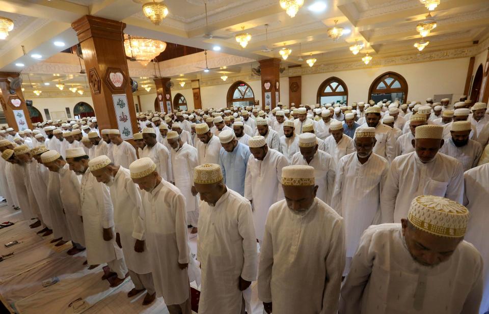  Members of the Dawoodi Bohra community say prayers at a mosque in India