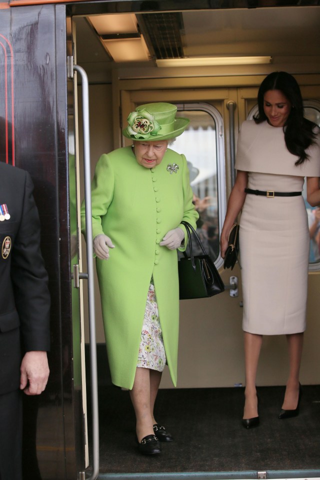 The Queen herself made sure to stand out – donning a bright green dress for the day out