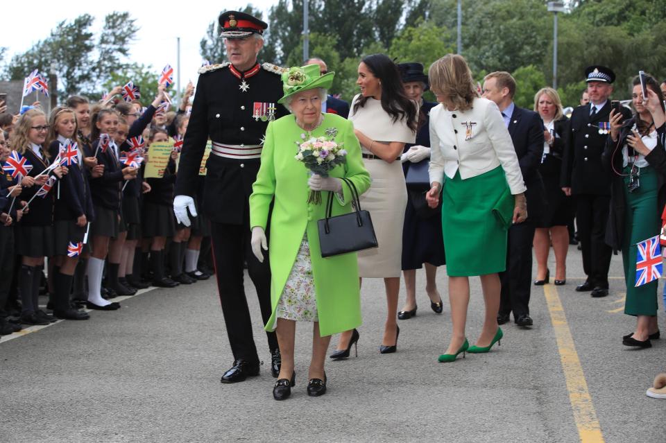  The Queen was handed some flowers on her arrival