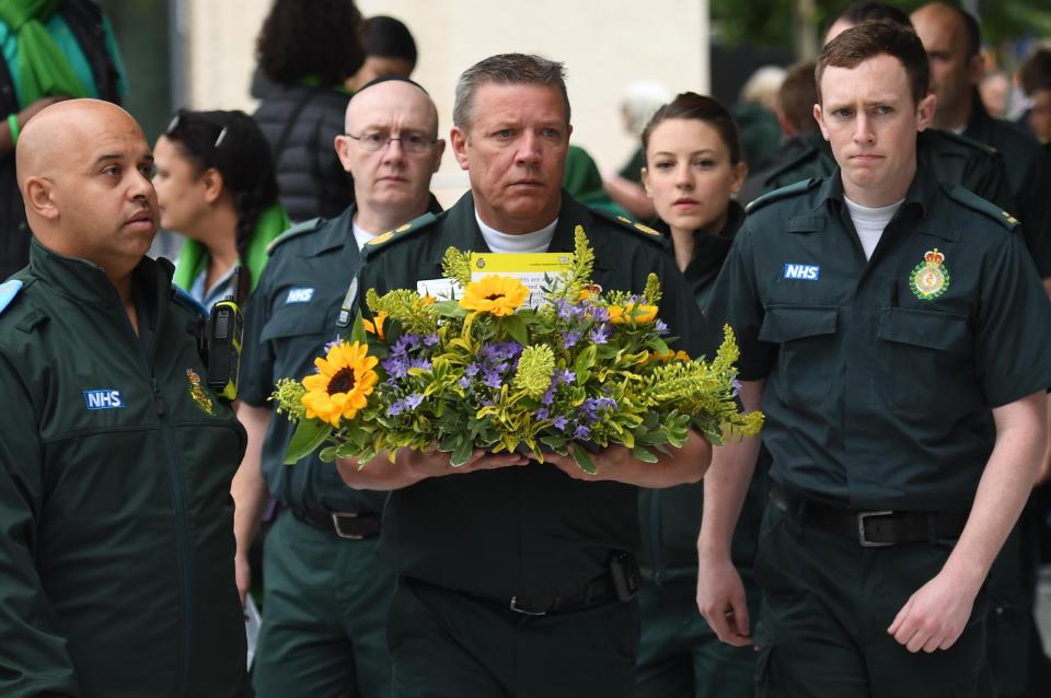  Staff from the London Ambulance Service arrive for the Grenfell Tower anniversary national minute silence and mosaic unveiling