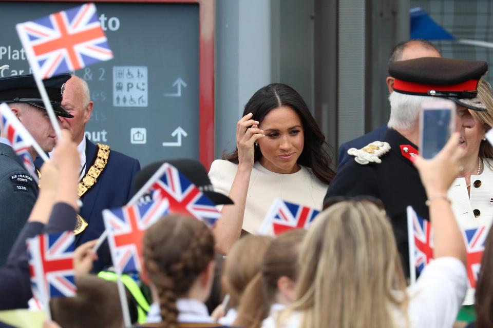  Meghan took to her new role extremely well today, smiling and chatting to young children waiting to meet her