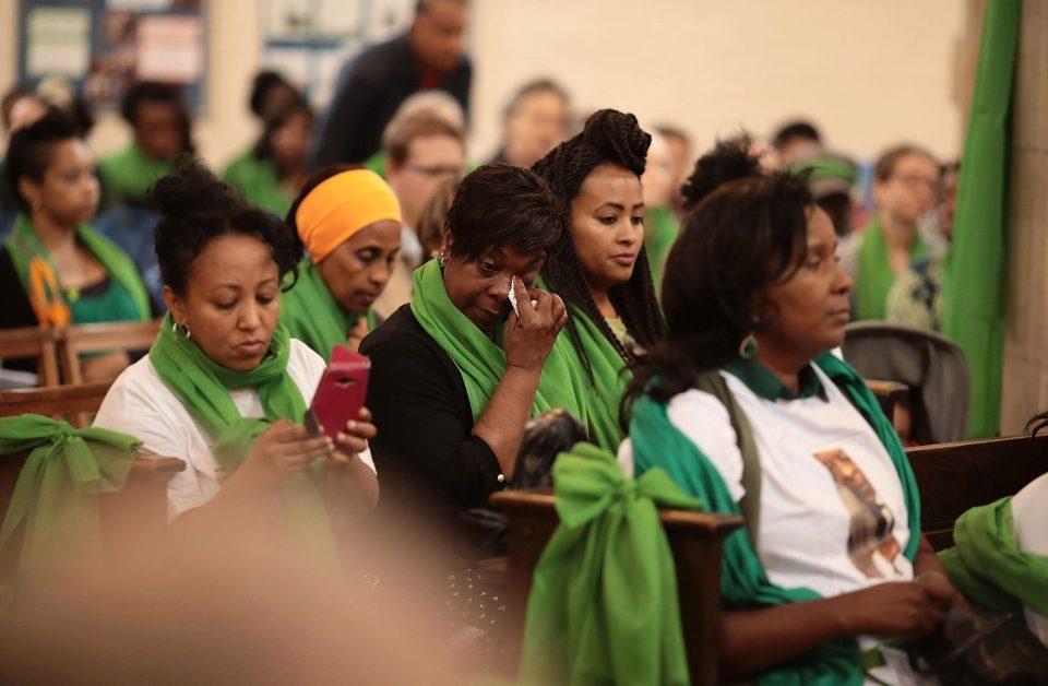  A woman wipes away tears as she attends a memorial service at St Helen's Church to mark the one year anniversary of the Grenfell Tower fire