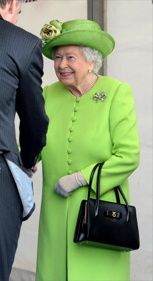  The monarch donned a bright green dress by Stewart Parvin and matching hat by Rachel Trevor Morgan