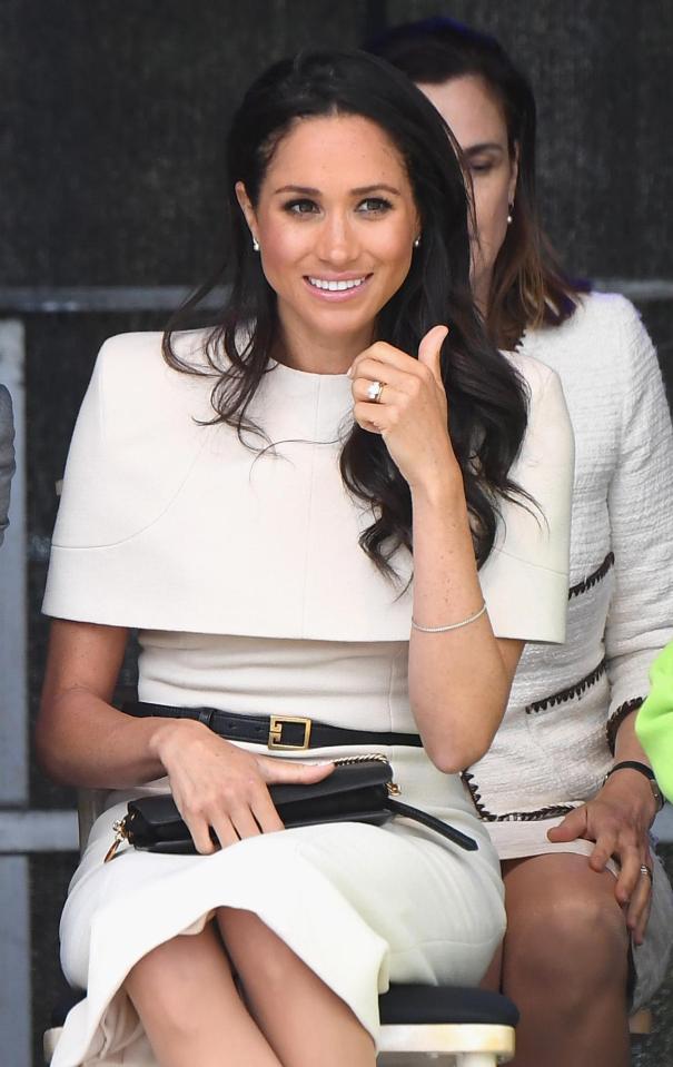  Meghan Markle shows off her wedding and engagement ring after tying the knot with Prince Harry in May