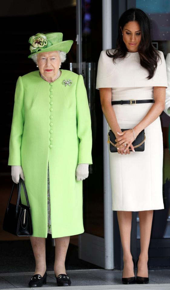  Meghan also carries a black clutch for her first public appearance without Prince Harry in Cheshire