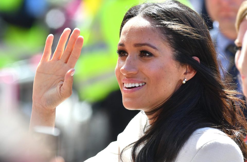  Meghan also took a leaf from the Queen's book with her regal wave