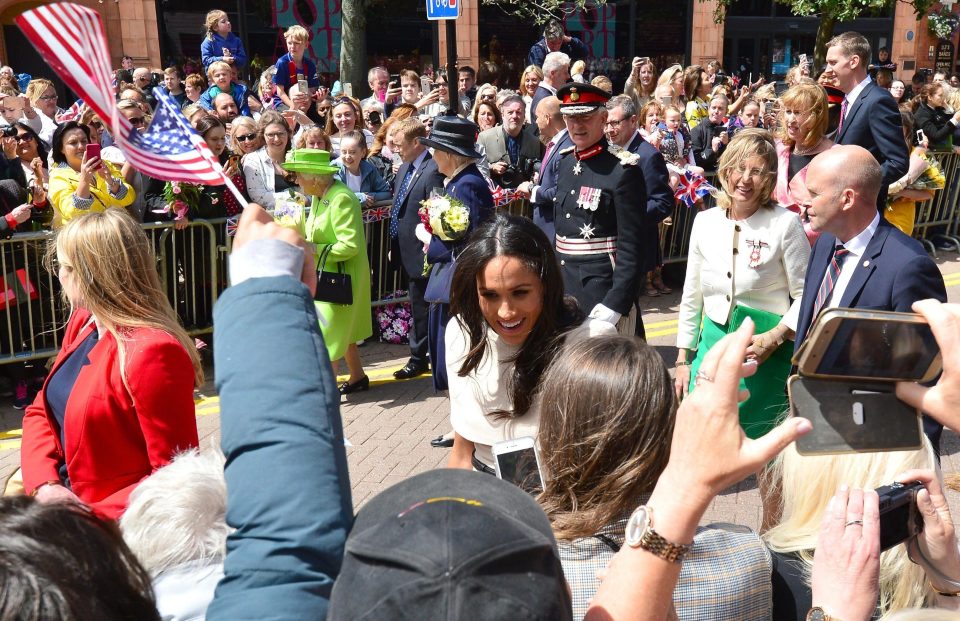  The Queen and Meghan met with adoring fans during their trip