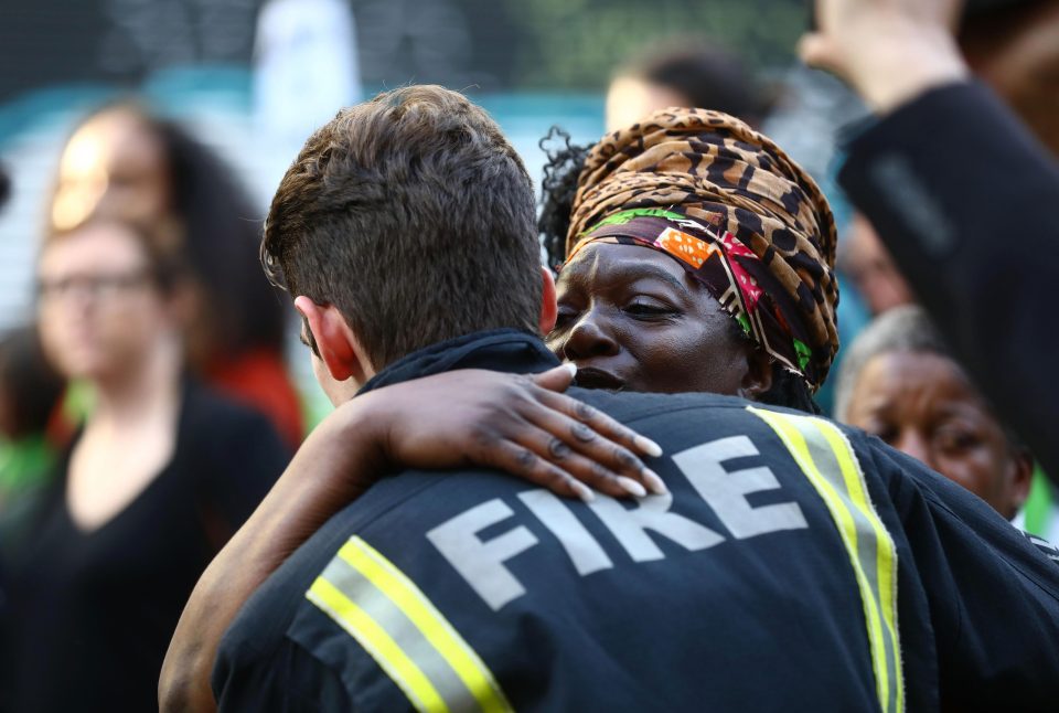  People stop to hug firefighters during the silent march