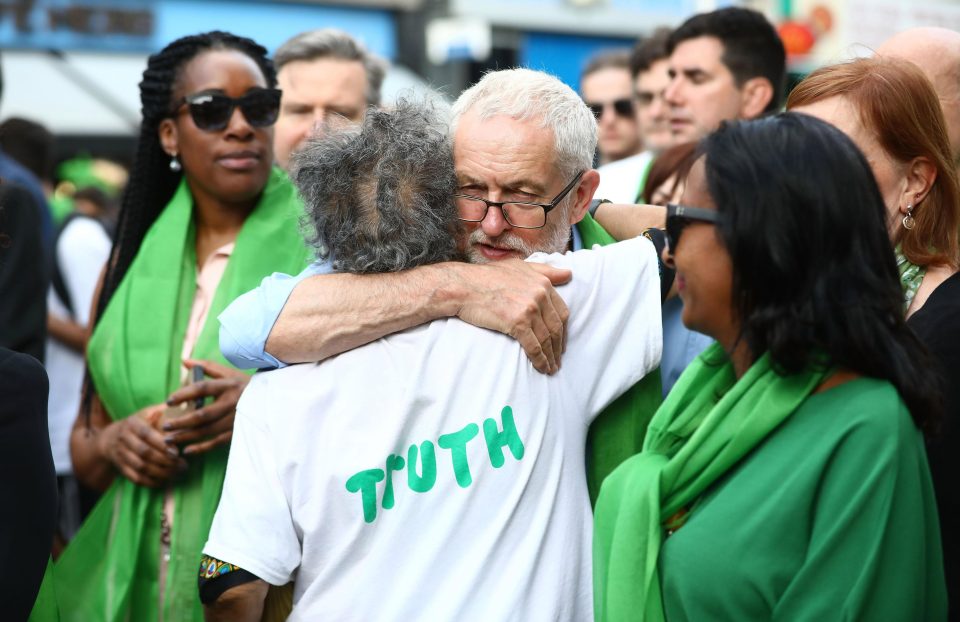  Leader of the Labour Party, Jeremy Corbyn hugs a member