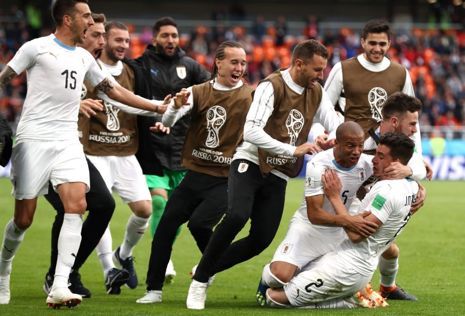  Uruguay players celebrate after Gimenez steered his header beyond Mohamed El-Shenawy