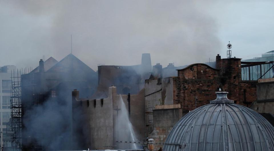  Smoke could still be seen rising from the ruins of the prestigious art school