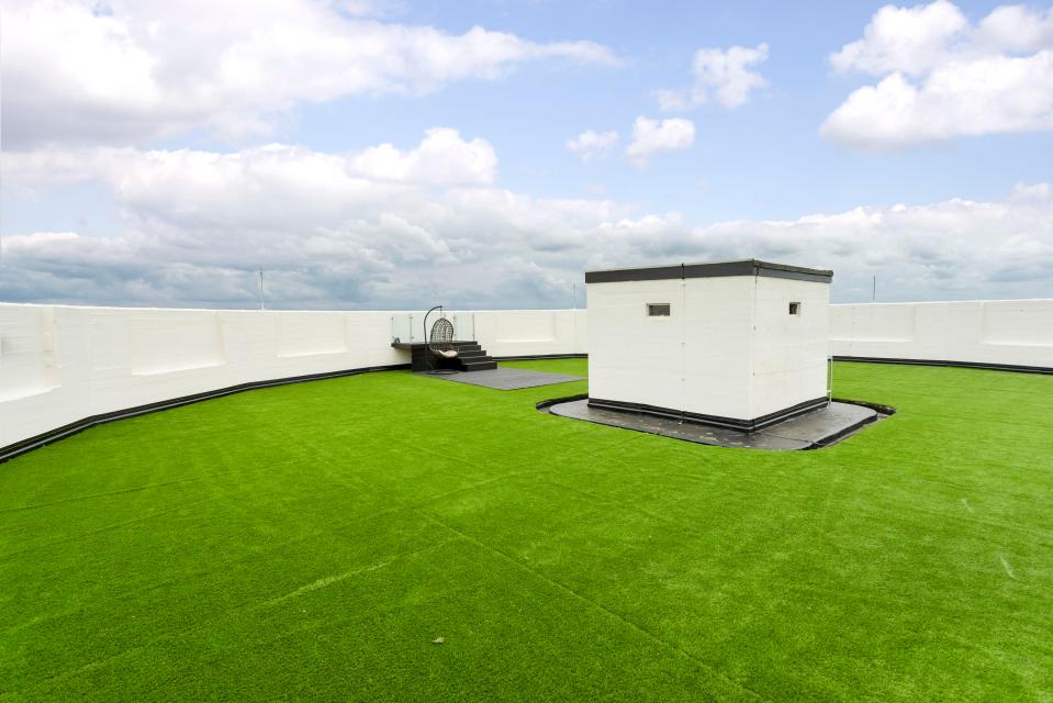  A 3,391 sq ft roof terrace, which is covered in astro turf, can be enjoyed year round