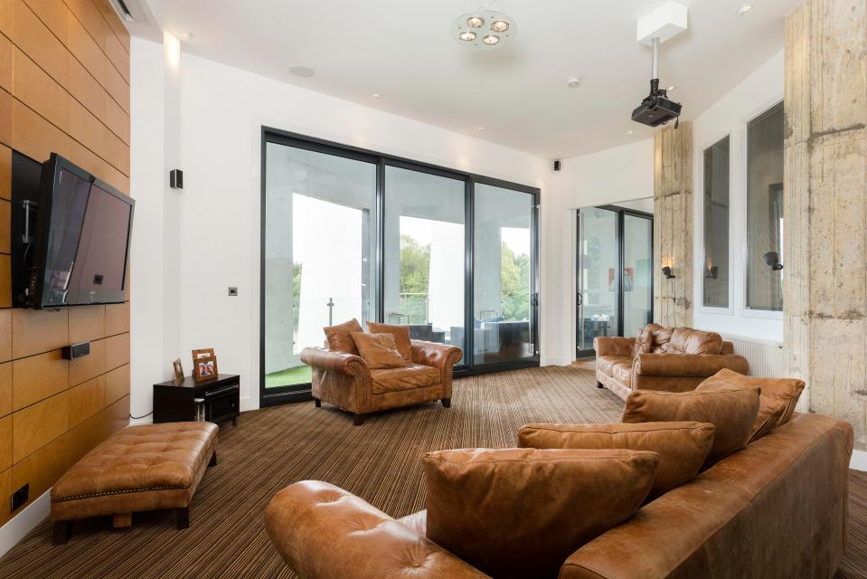  Floor-to-ceiling doors in the living room open onto a terrace