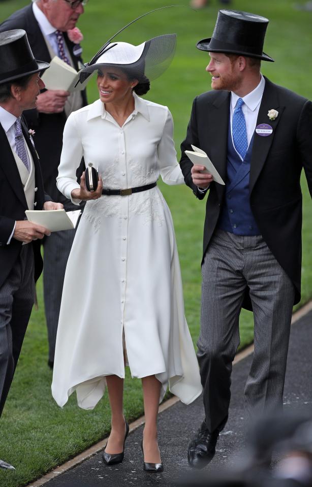  For the elegant event, she has chosen a Philip Treacy black and white hat to finish off her look