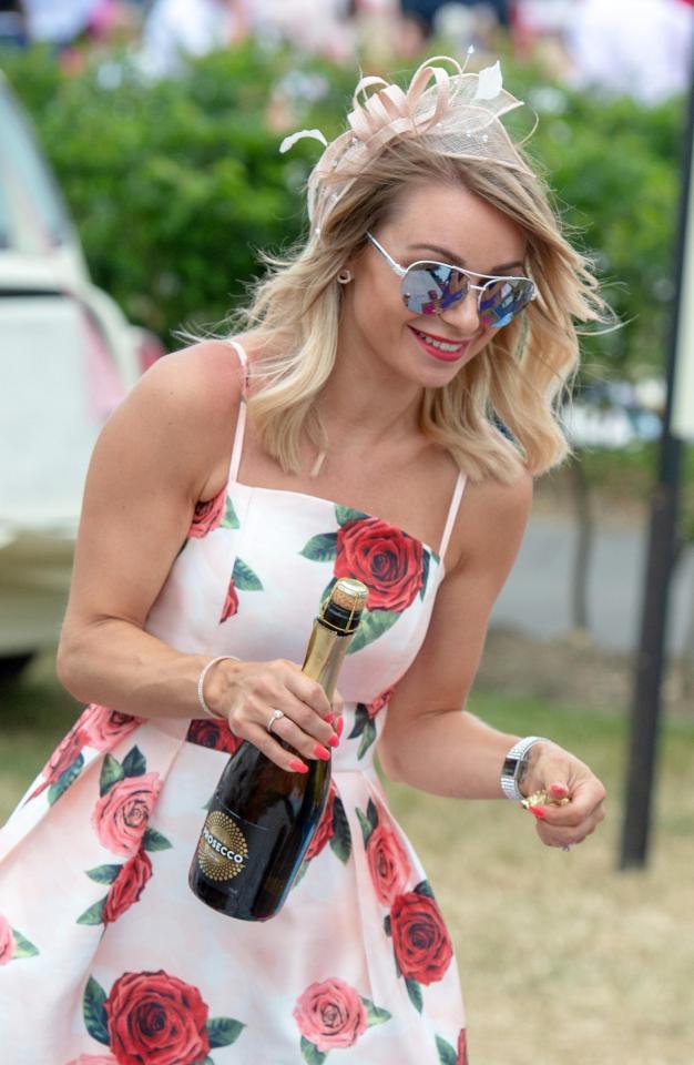  Well-dressed punters were seen popping open the bubbly as temperatures soared to the mid-twenties today