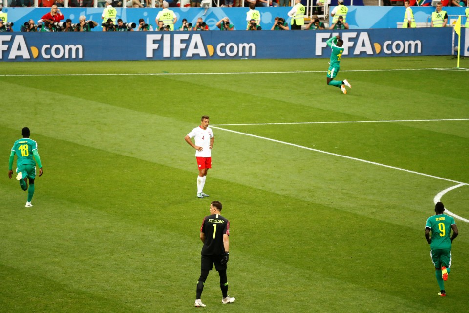 Wojciech Szczesny stands 35 yards off his line as M'Baye Niang celebrates