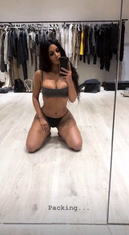  Kim posed in her underwear as she packed her bags