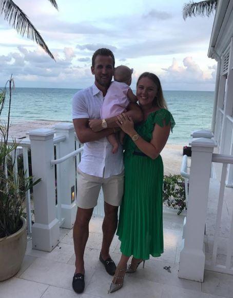  England captain Harry Kane with his fiancee Kate Goodland and their young daughter Ivy on holiday