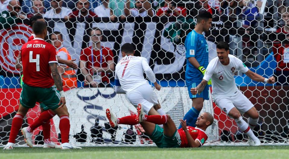  Ronaldo wheels away after his diving header had stunned Morocco