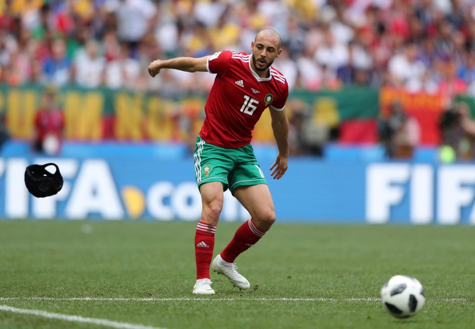  Nordin Amrabat threw off the scrum hat he was wearing to protect his head after suffering concussion against Iran