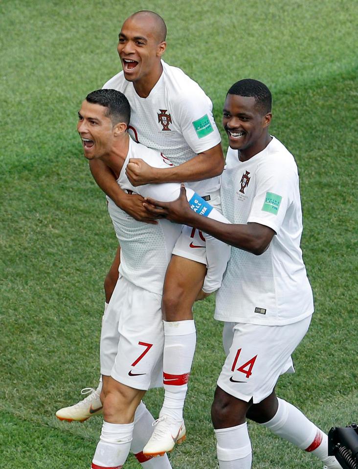  Joao Mario and William Carvalho celebrate with goal hero Ronaldo as Portugal took a big step towards reaching the last 16