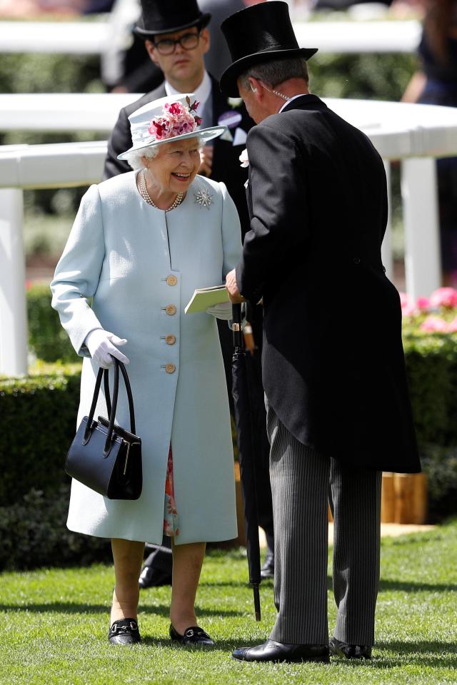  The Queen was in high spirits as she was greeted at the racecourse