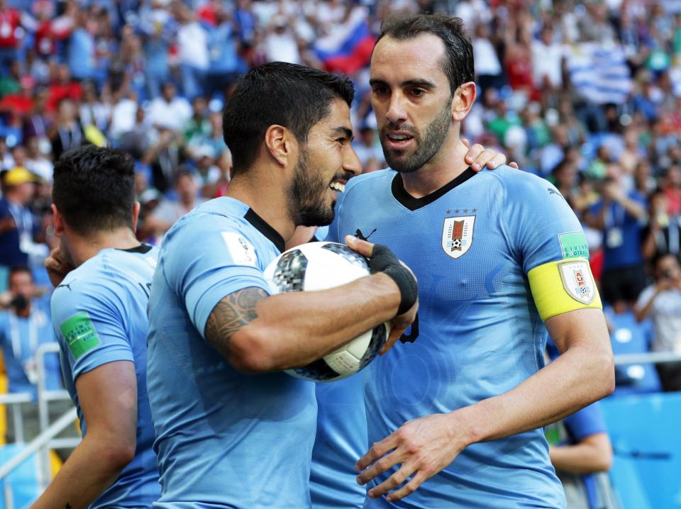 Uruguay celebrate taking an all-important early lead against Saudi Arabia