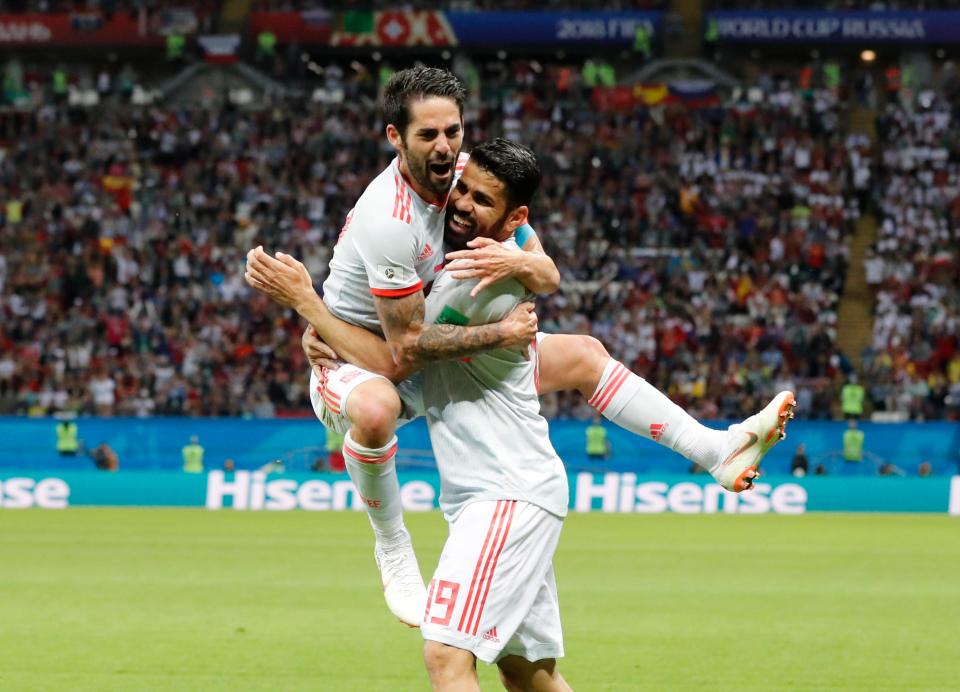  Isco jumps on Diego Costa to celebrate Spain ending Iran's resistance