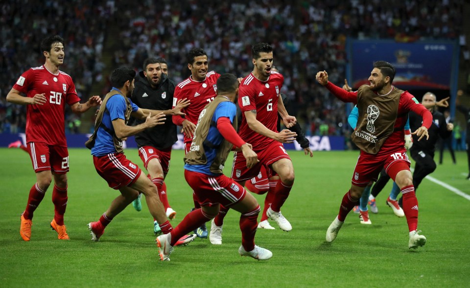 Iran’s players celebrate wildly after believing they had levelled