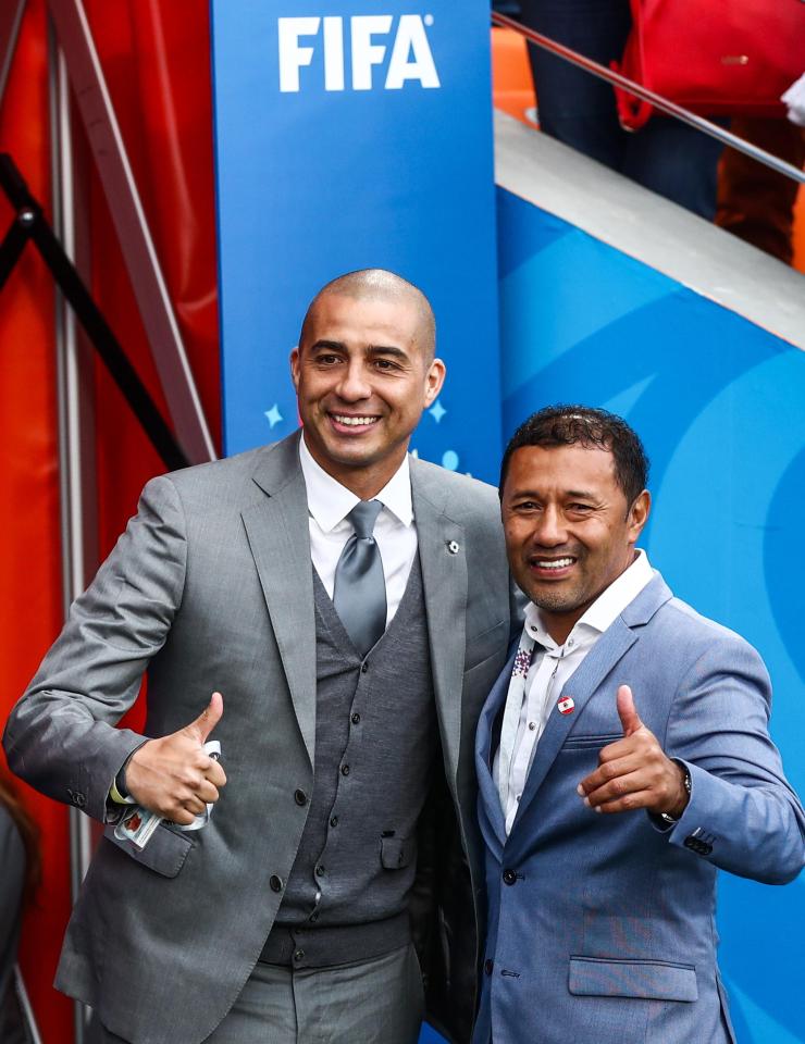  The retired France striker David Trezeguet, pictured left with former Peru star Roberto Palacios, was in the crowd to cheer Kylian Mbappe as he broke his 20-year record