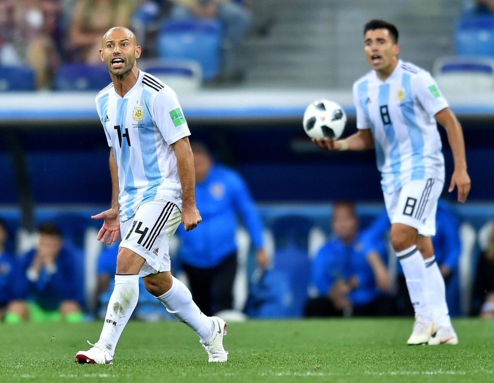  Javier Mascherano desperately tries to urge his struggling side into action against Croatia