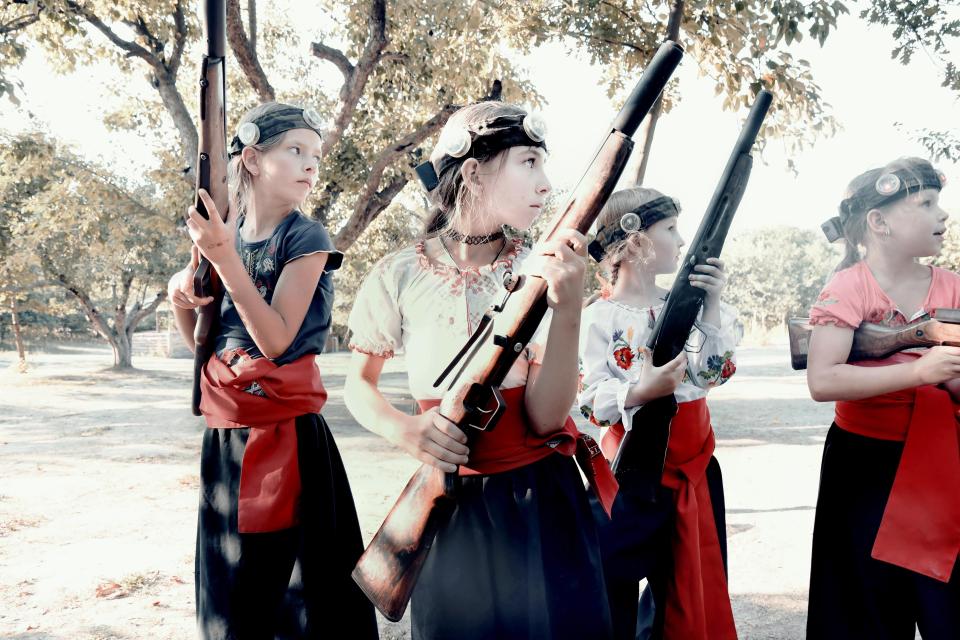  Young girls practice shooting in a Cossack patriotic camp that trains them with weapons and teaches them to hate the Russian influence and all its forms