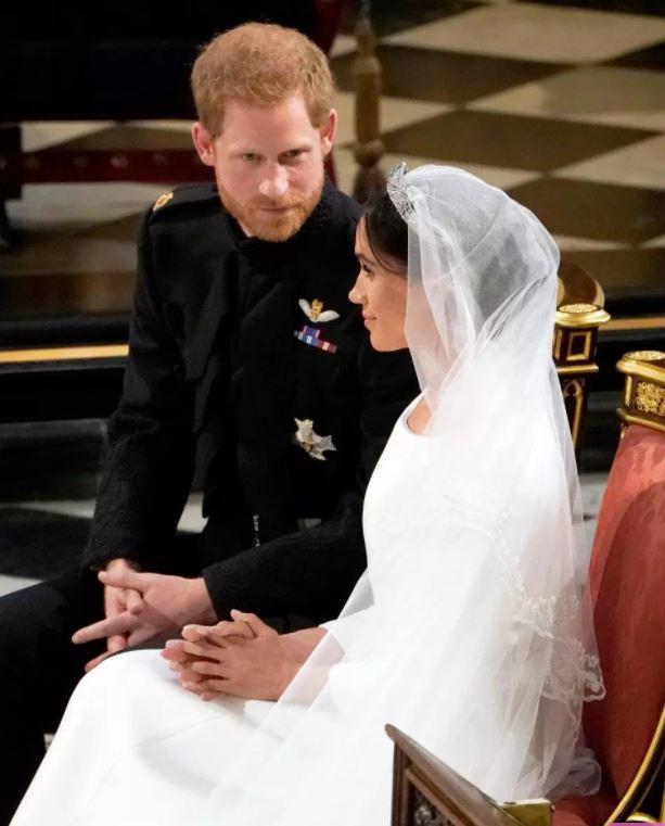  Meghan looked calm and collected on her wedding day and didn't fiddle with her hands in her lap