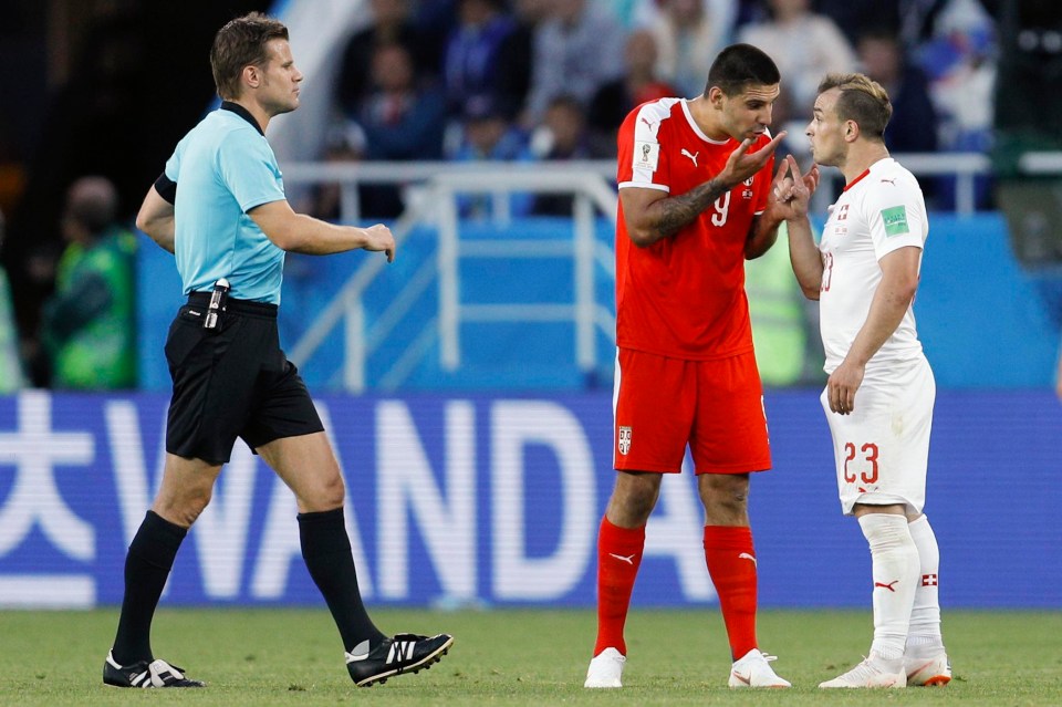 Xherdan Shaqiri, right, argues with Serbia scorer Aleksandar Mitrovic