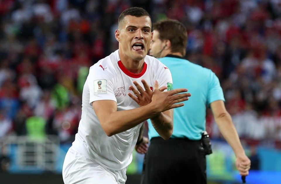 Granit Xhaka celebrates scoring a screamer for Switzerland with a provocative Albanian eagle salute in a nod to his heritage