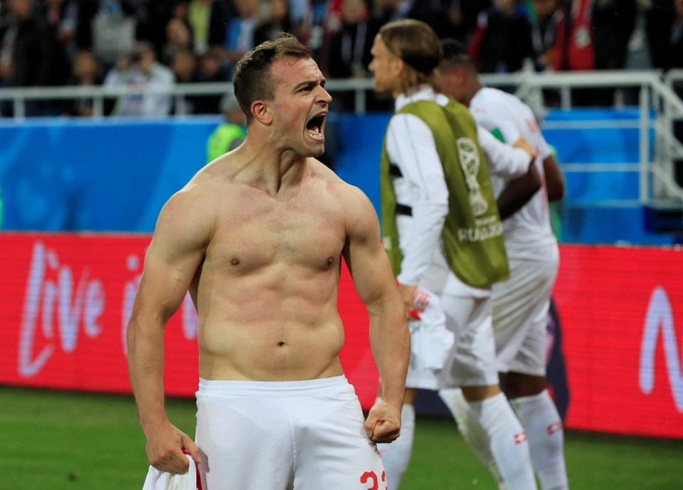 A bare-chested Shaqiri roars after sending Switzerland above Serbia in the table