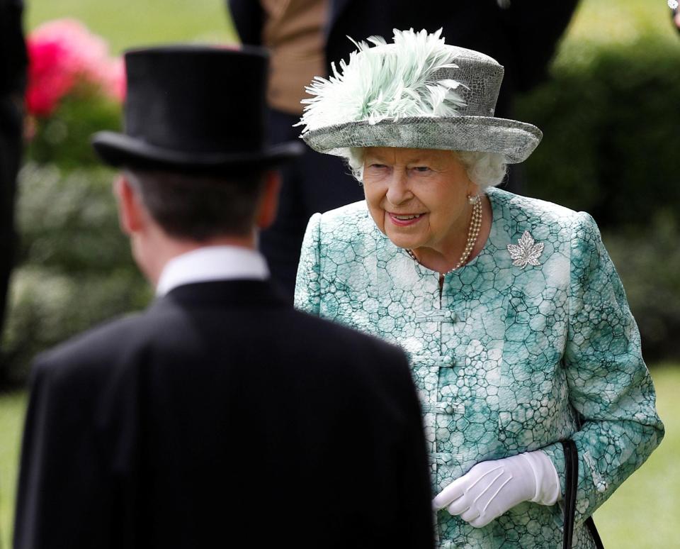  Her Maj smiles as she makes her way to the Royal pavilion to watch the final day's racing