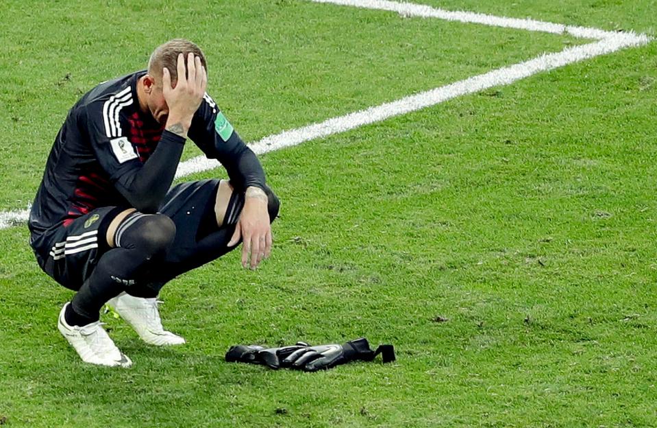  Swedish keeper Robin Olsen holds his head in his hands after coming within seconds of a point