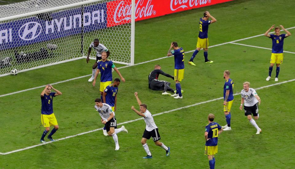  Sweden team look distraught after Germany's winner flies in