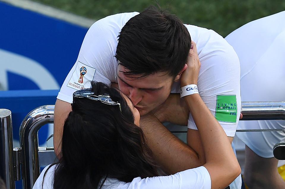  The England centre-half gets a smackers from his fiancee after his fine performance