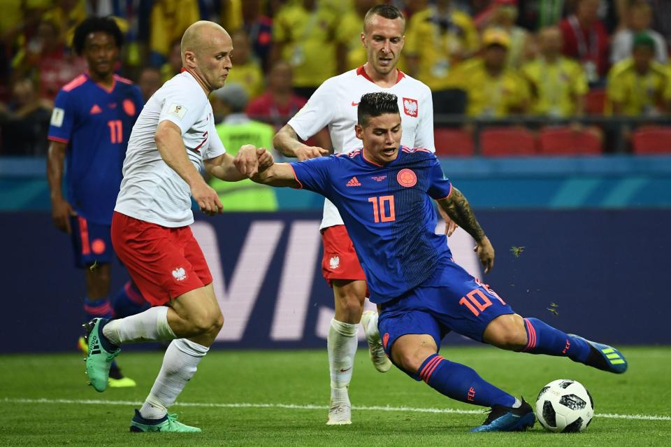  Colombia ace James Rodriguez in action against Michal Pazdan