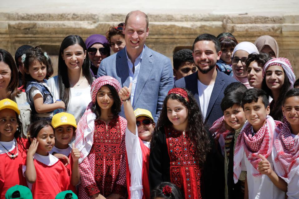  The Prince poses for a photograph with children in Jordan, including Syrian refugees