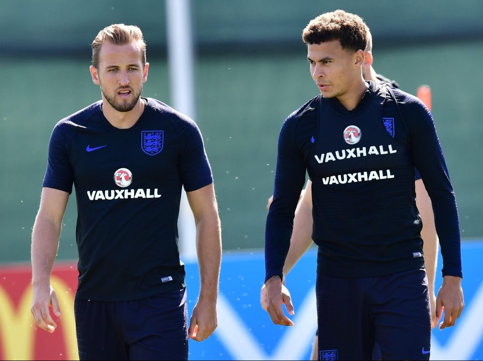  Harry Kane warms up with Dele Alli as he prepared for the group decider