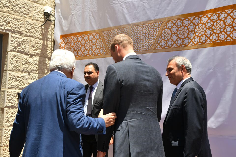  Mahmoud Abbas takes Prince William by the arm as he leads him through to his office