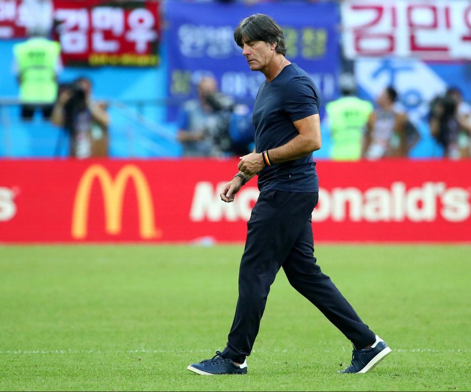  Germany chief Joachim Low strides off dejected after a 2-0 defeat against South Korea meant their earliest World Cup exit for 80 years