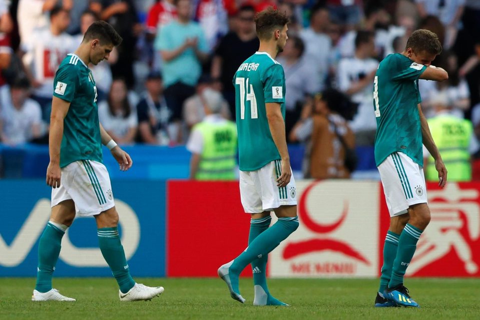  Germany players slump off after a 2-0 defeat sent them out when only victory would do