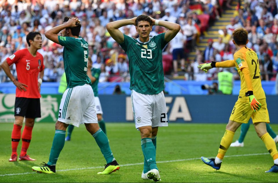  Mario Gomez and Mats Hummels show the shock and shame as holders Germany are knocked out after two defeats in three group matches