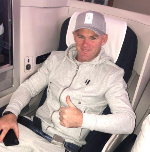  Wayne Rooney gives the thumbs-up moments before jetting off to Washington