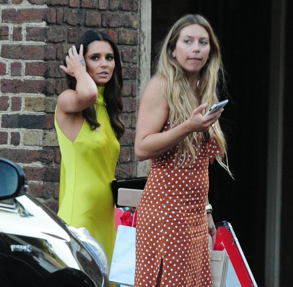  Afterwards Cheryl was spotted with a goody bag from the bash which appeared to contain flowers